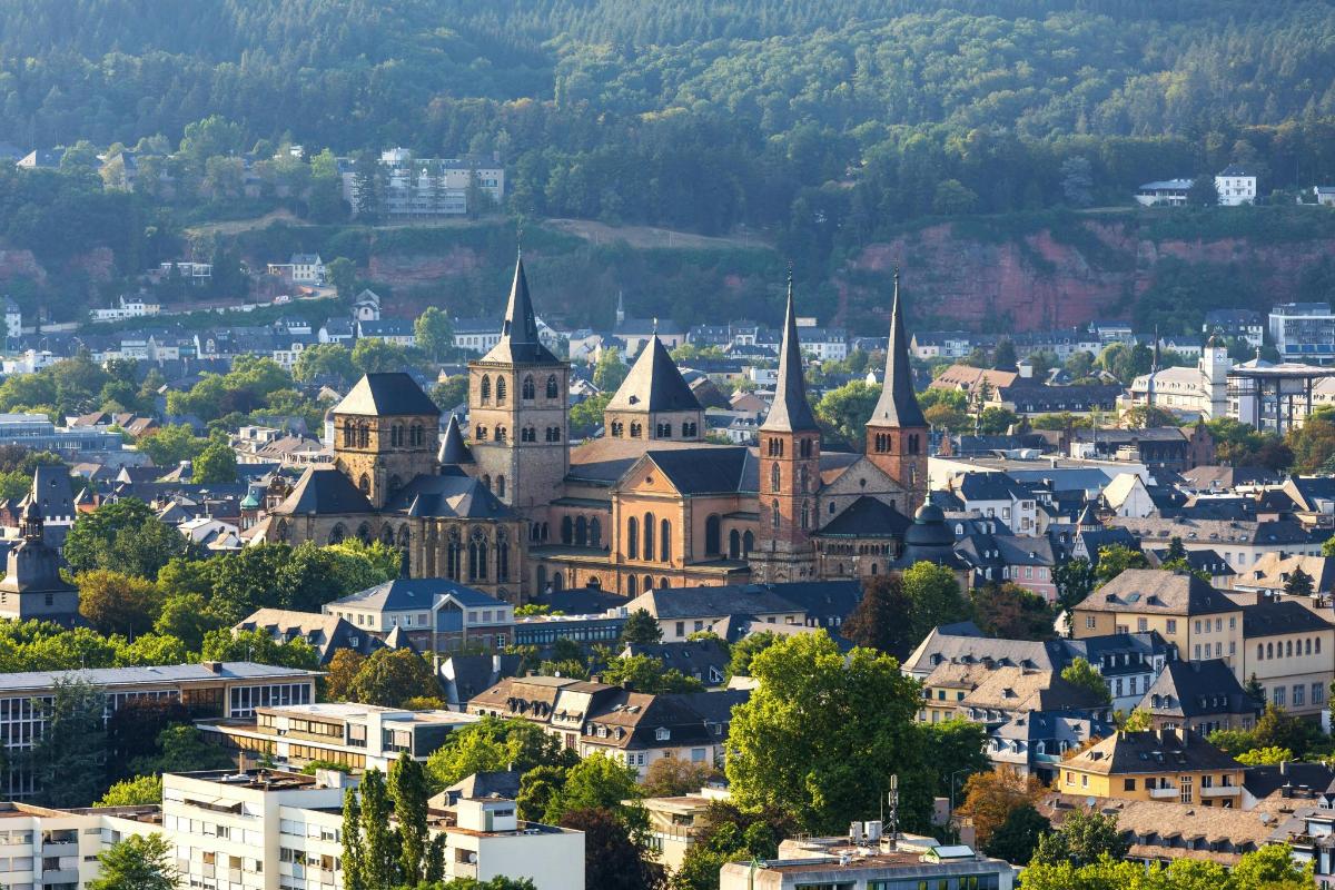an aerial view of a city with a church