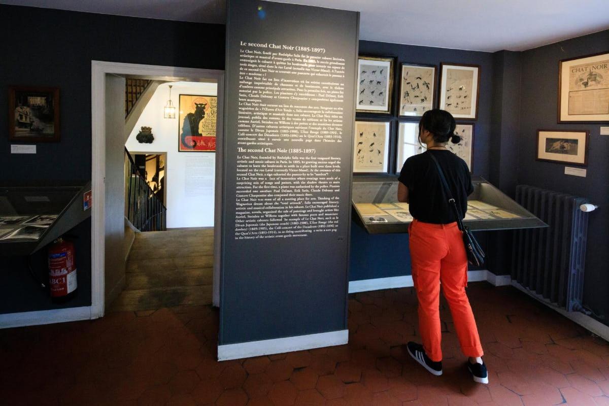 a woman looking at a display in a museum