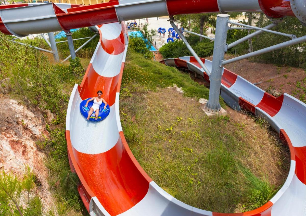 a red and white train on a roller coaster