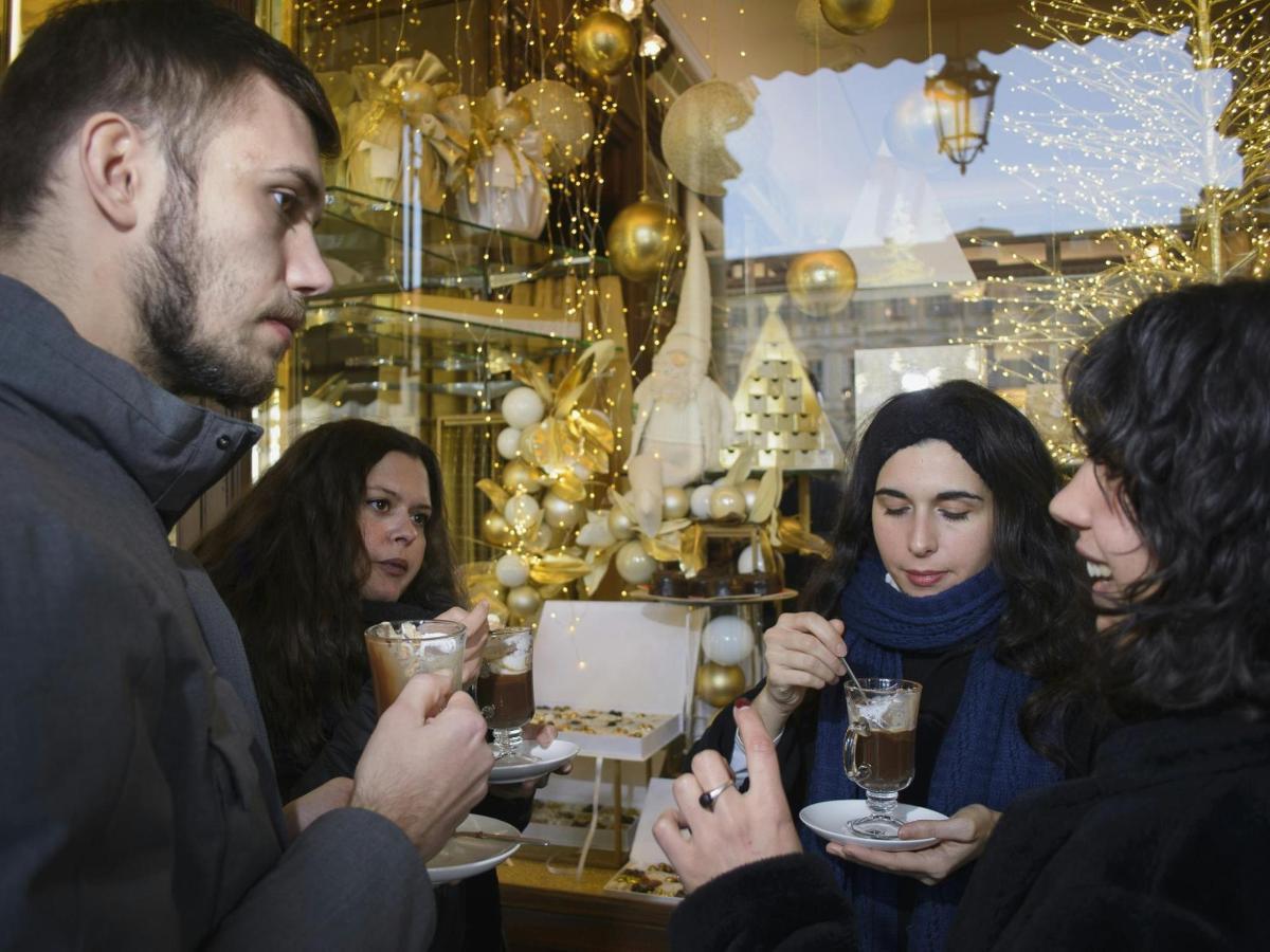a group of people sitting at a table with drinks