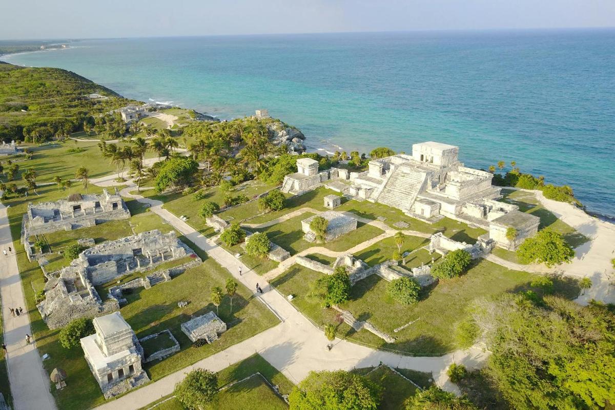 an aerial view of a large castle on the ocean