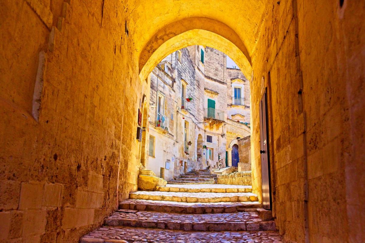 an alley in an old town with stone steps