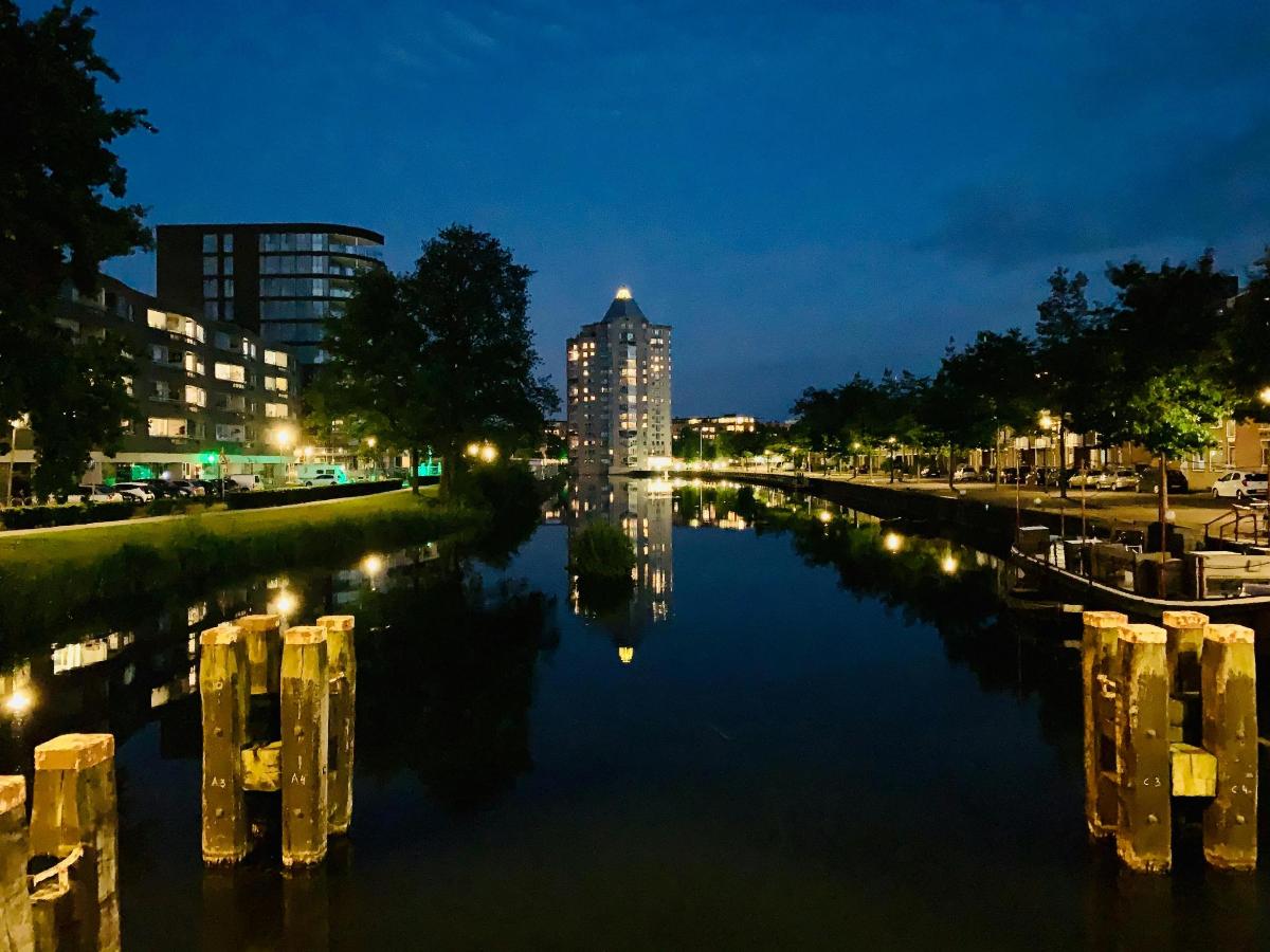 a view of a river at night with a city