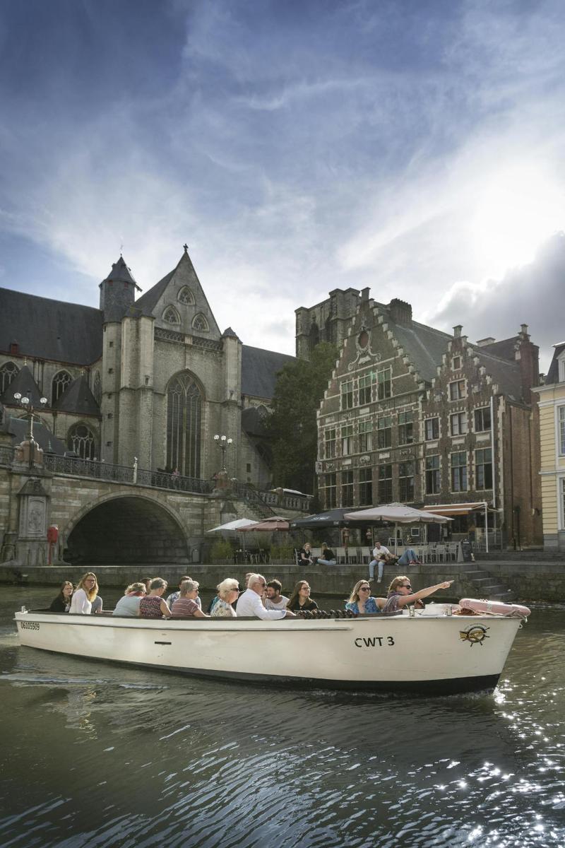 a group of people riding in a boat on the water