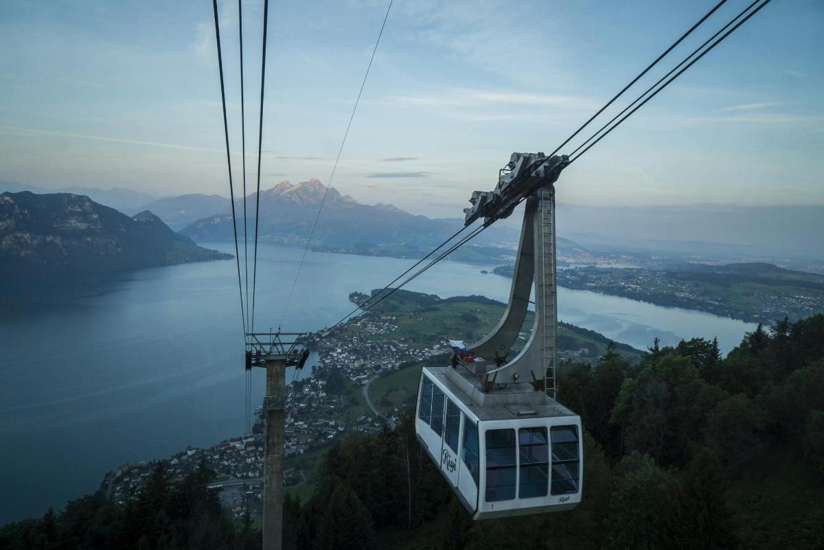 a gondola flying over a body of water