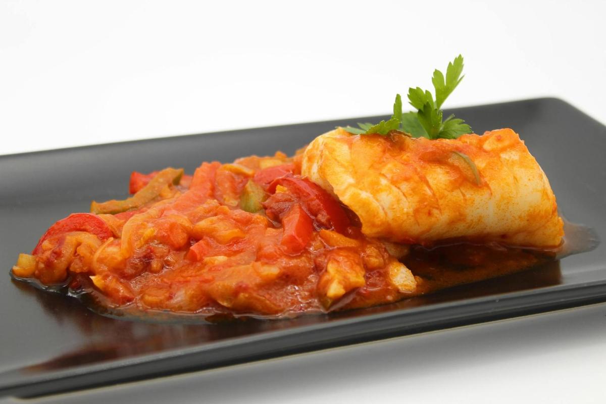 a plate of food with a piece of food