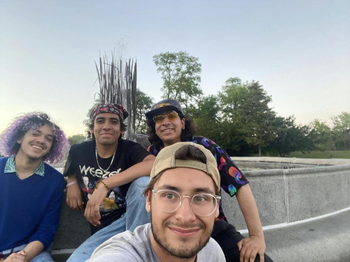 a group of people sitting in the back of a truck