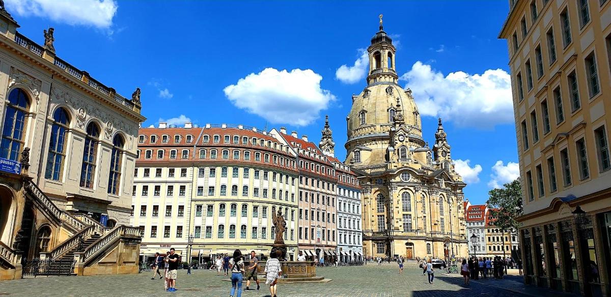 a group of buildings in a city with a clock tower