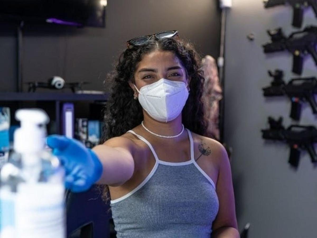 a woman wearing a mask and boxing gloves