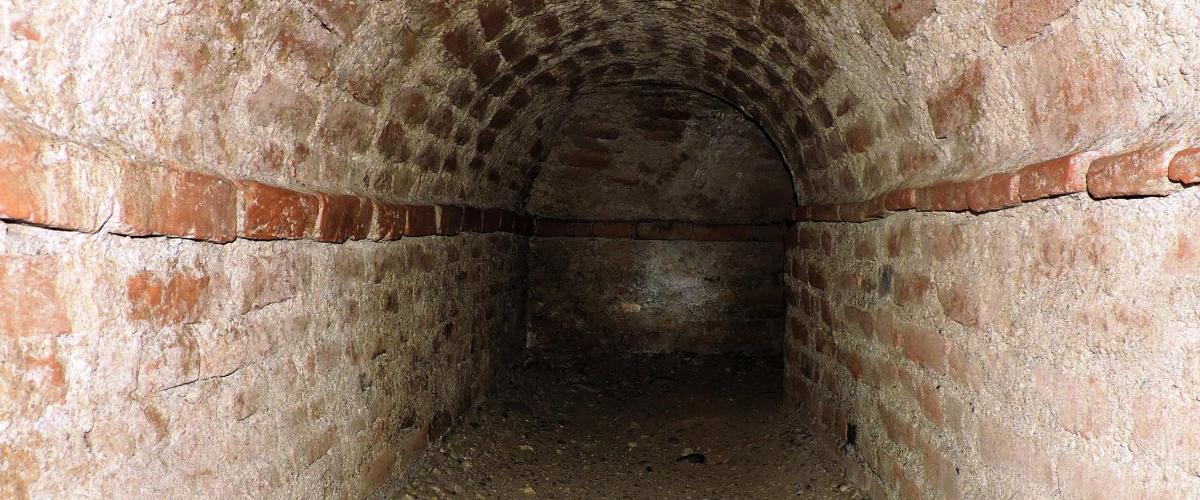 an old brick tunnel in a brick wall