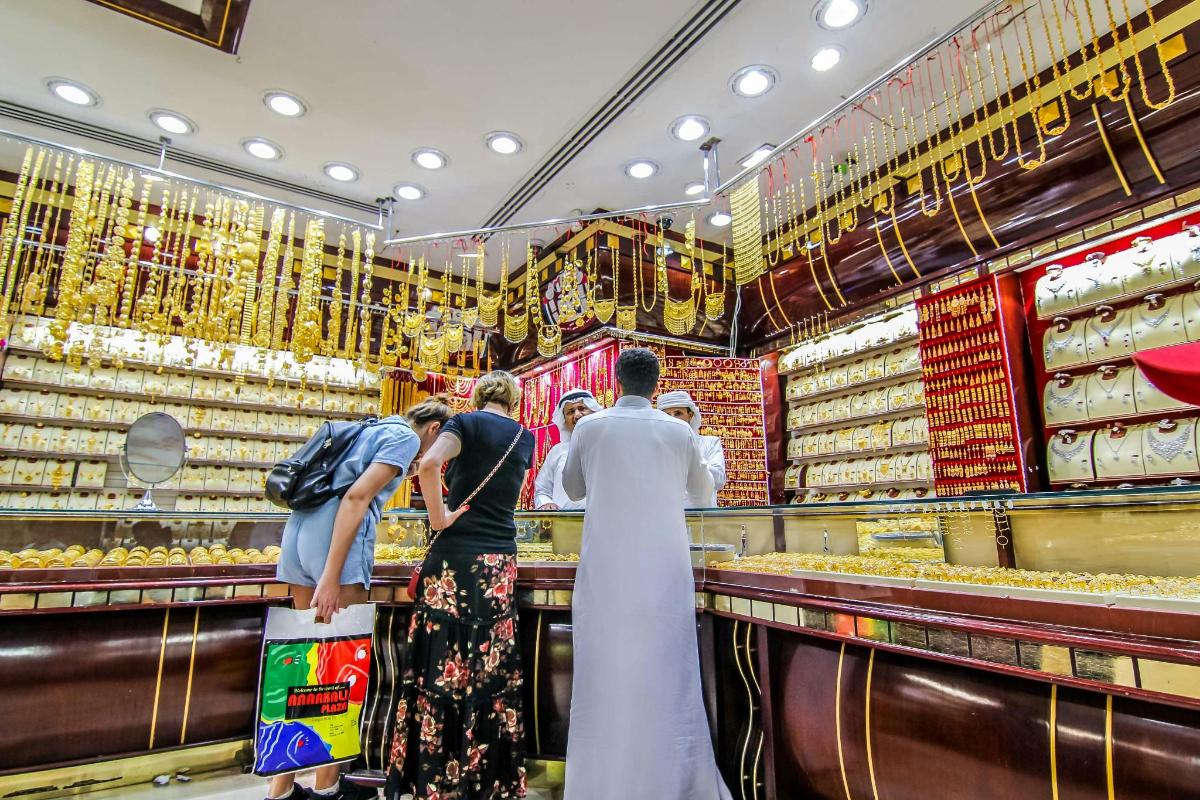 a group of people standing in a supermarket aisle