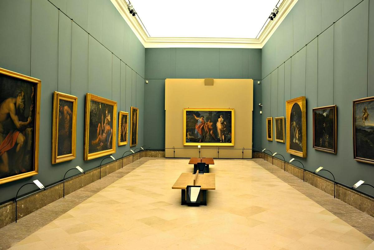 a large room with paintings on the walls