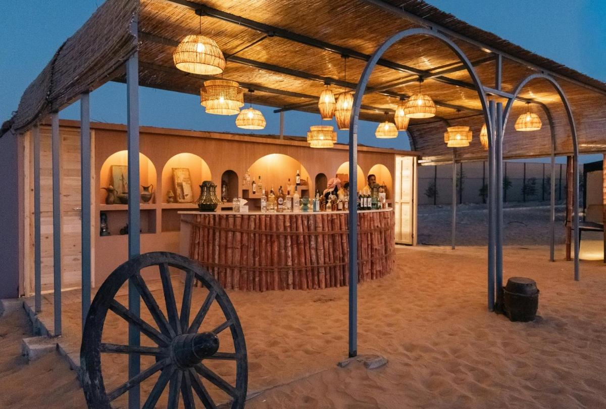 a view of a building with a wagon wheel and a bar