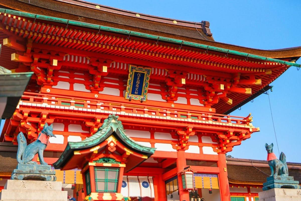 a large orange building with a horse in front of it