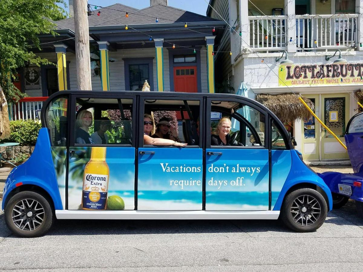 a small car with people sitting in it