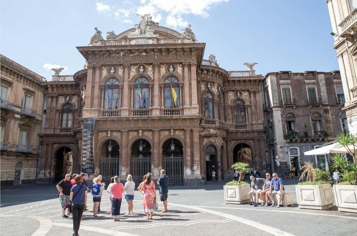 a group of people standing in front of a building