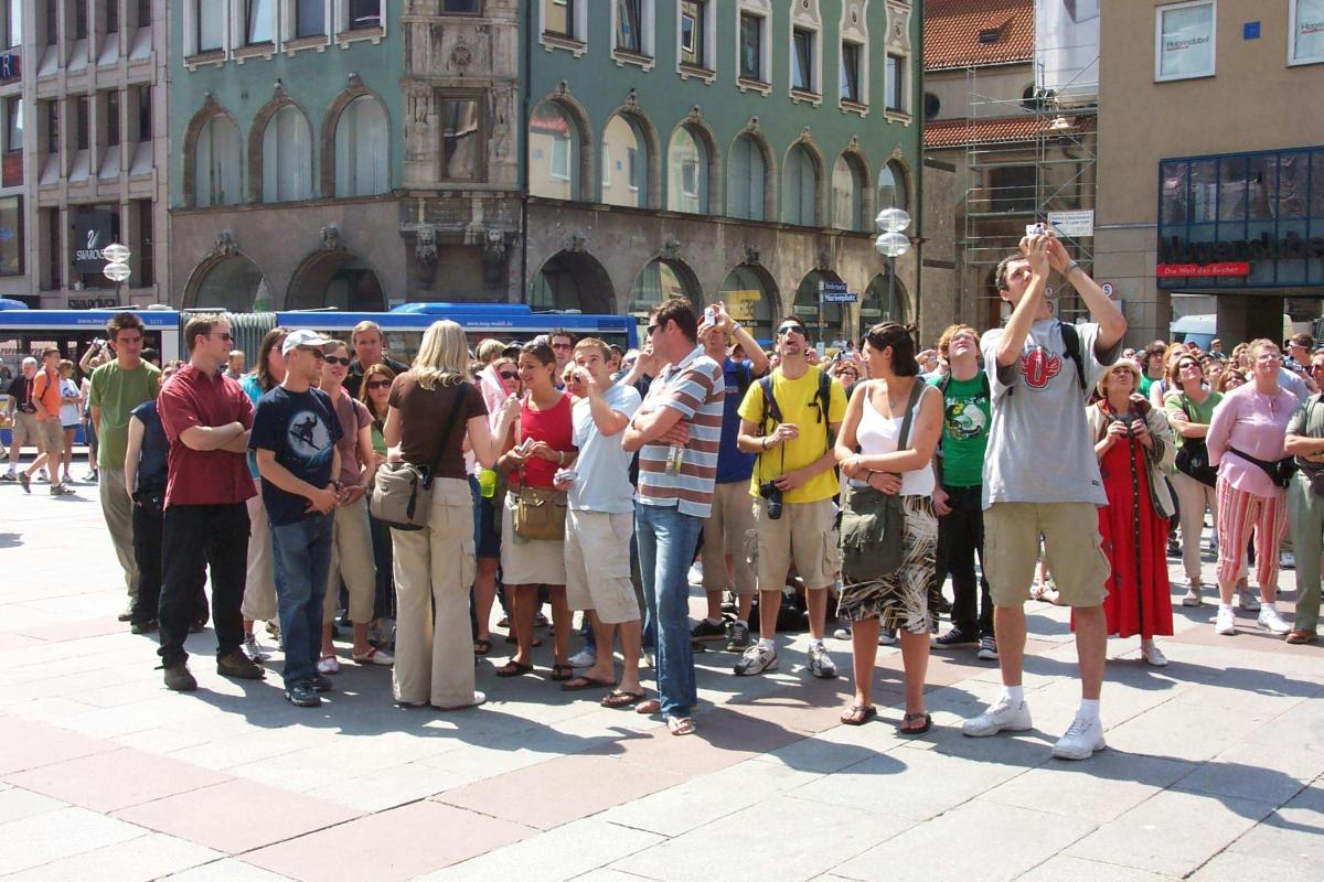a large group of people standing in a crowd