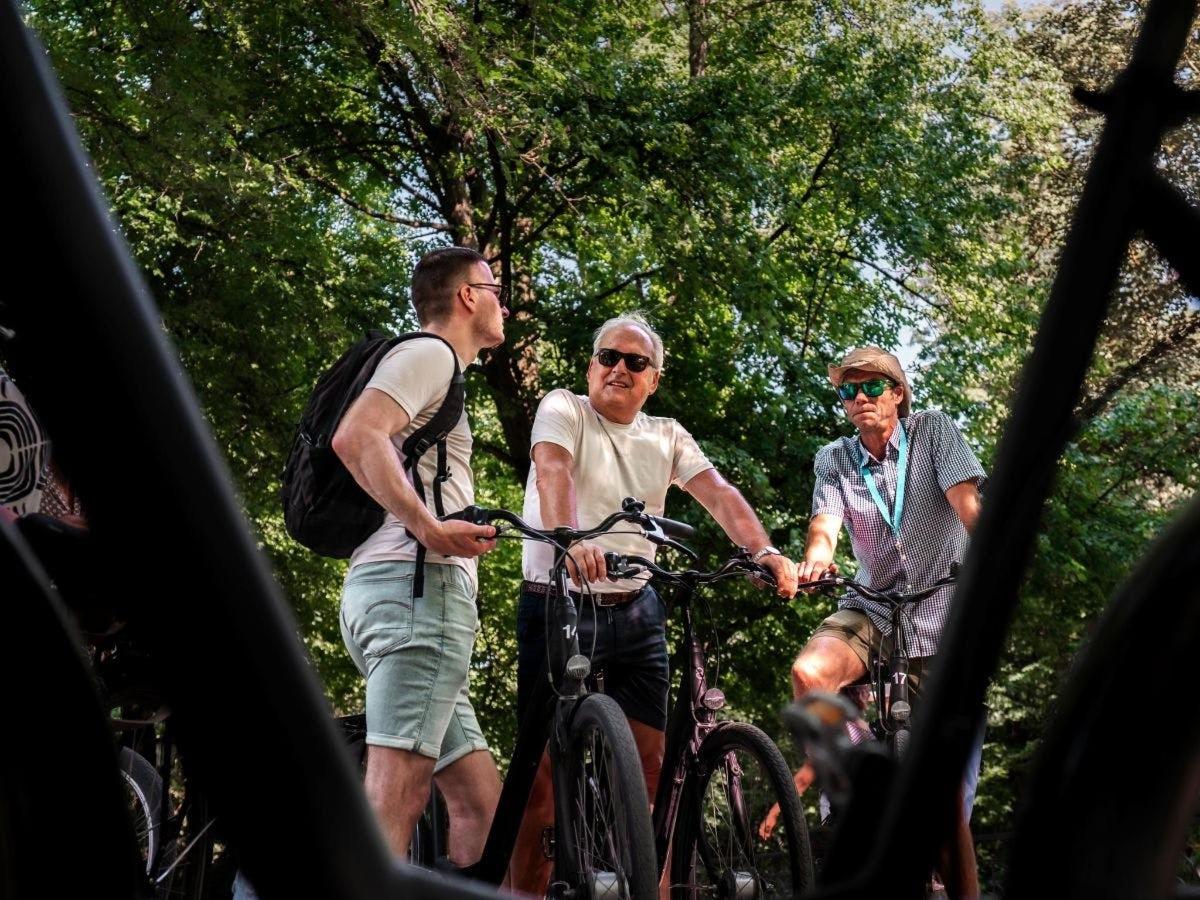 a group of people riding bikes on a trail