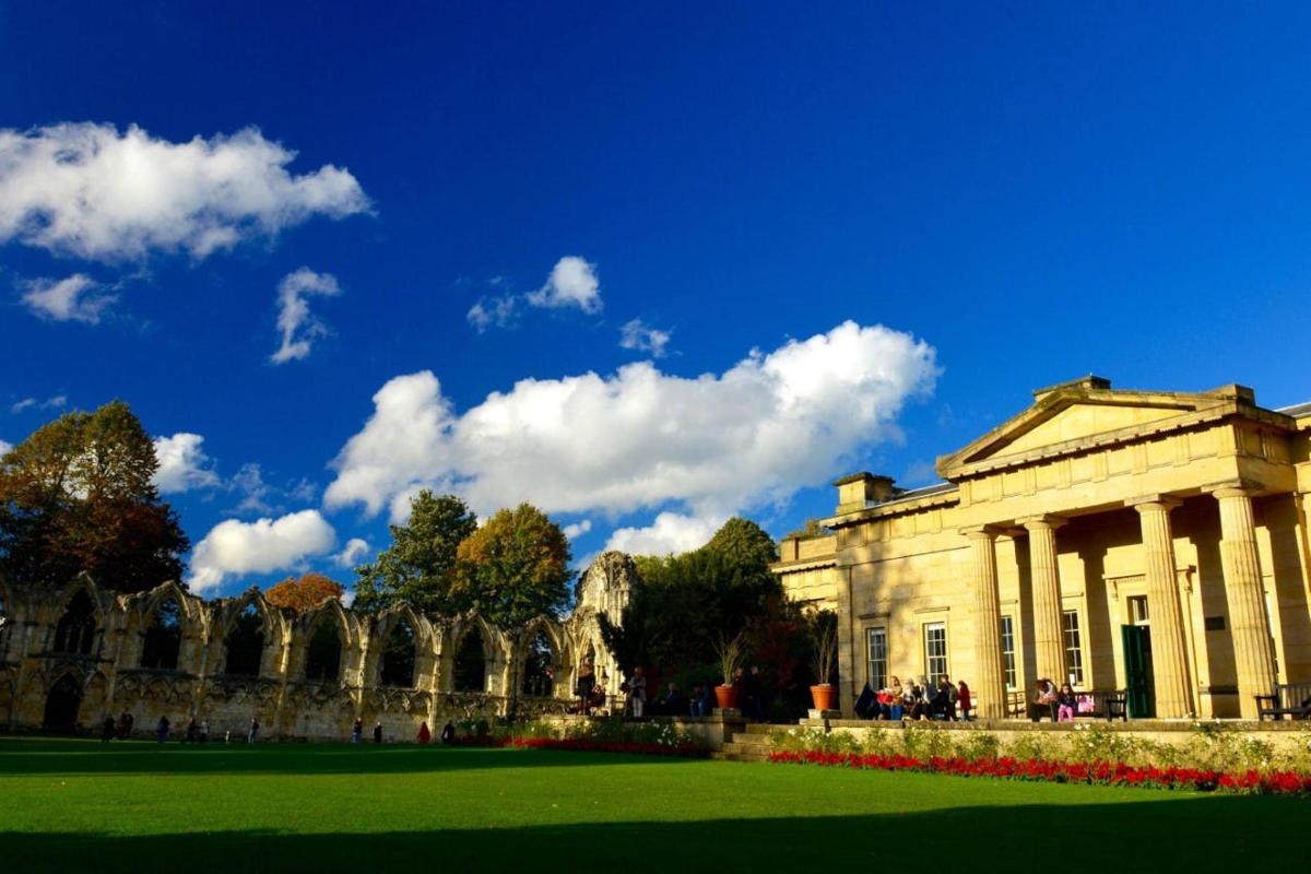 a building with a green lawn in front of it