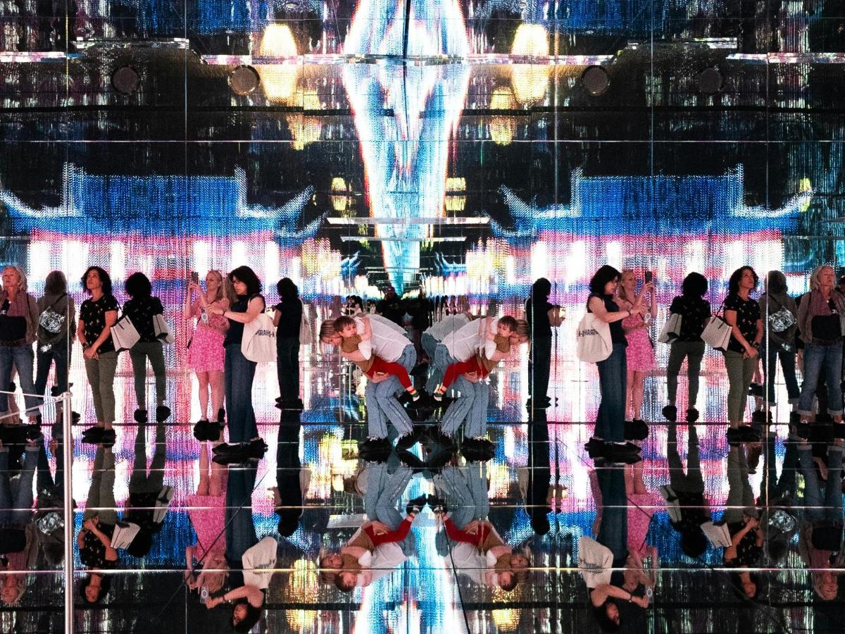 a group of people standing in front of a stage