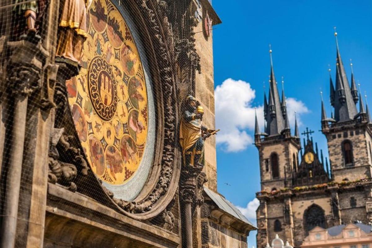 a clock on the side of a building with two towers
