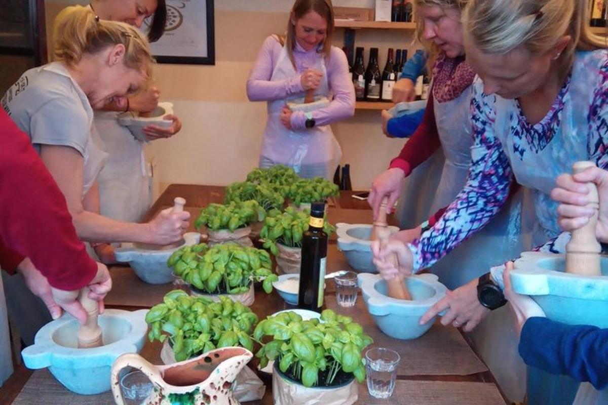 a group of people standing around a table preparing food