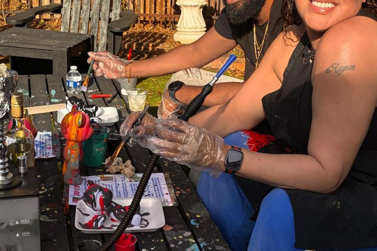 a couple of women sitting next to a table