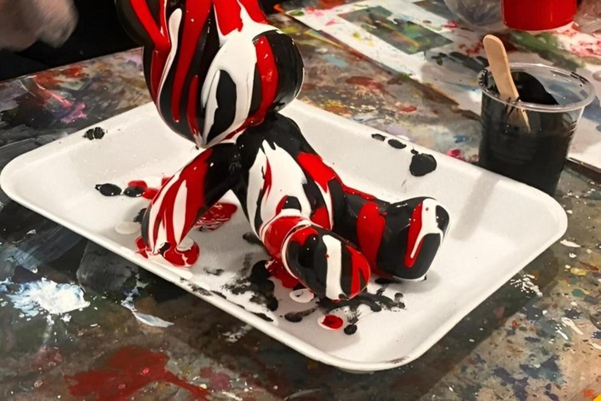 a white plate with a red and white dessert