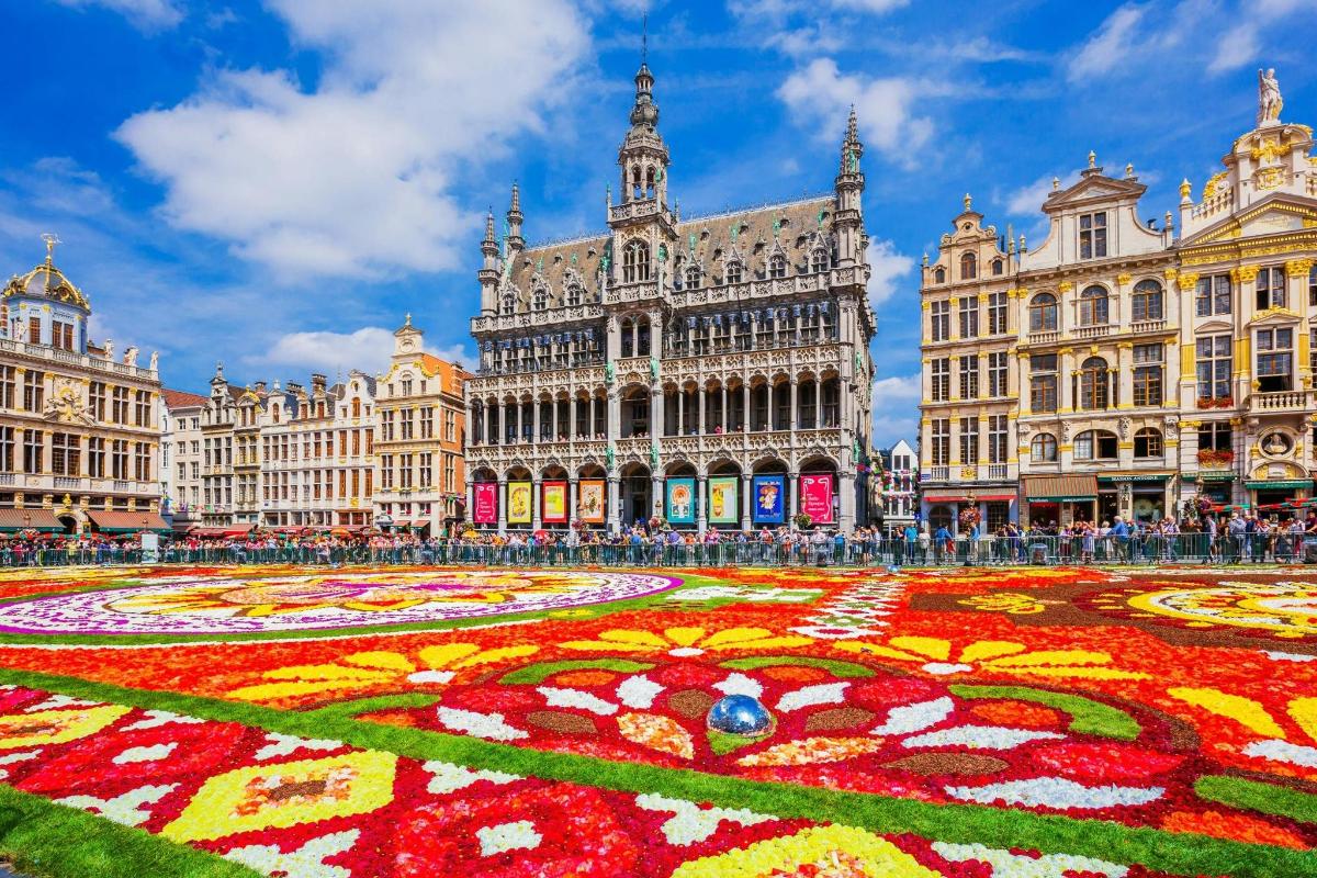 a large building with a large flower maze in the middle