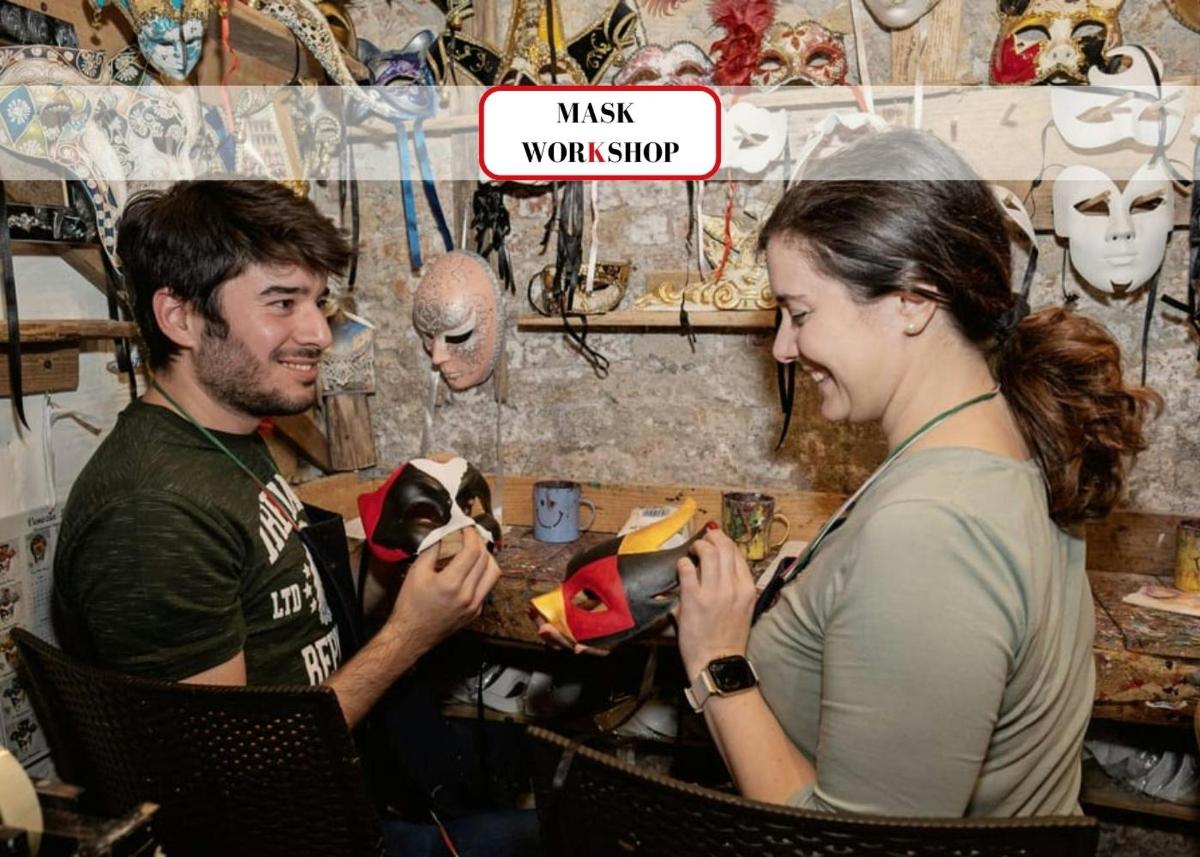 a man and a woman with a dog wearing a mask