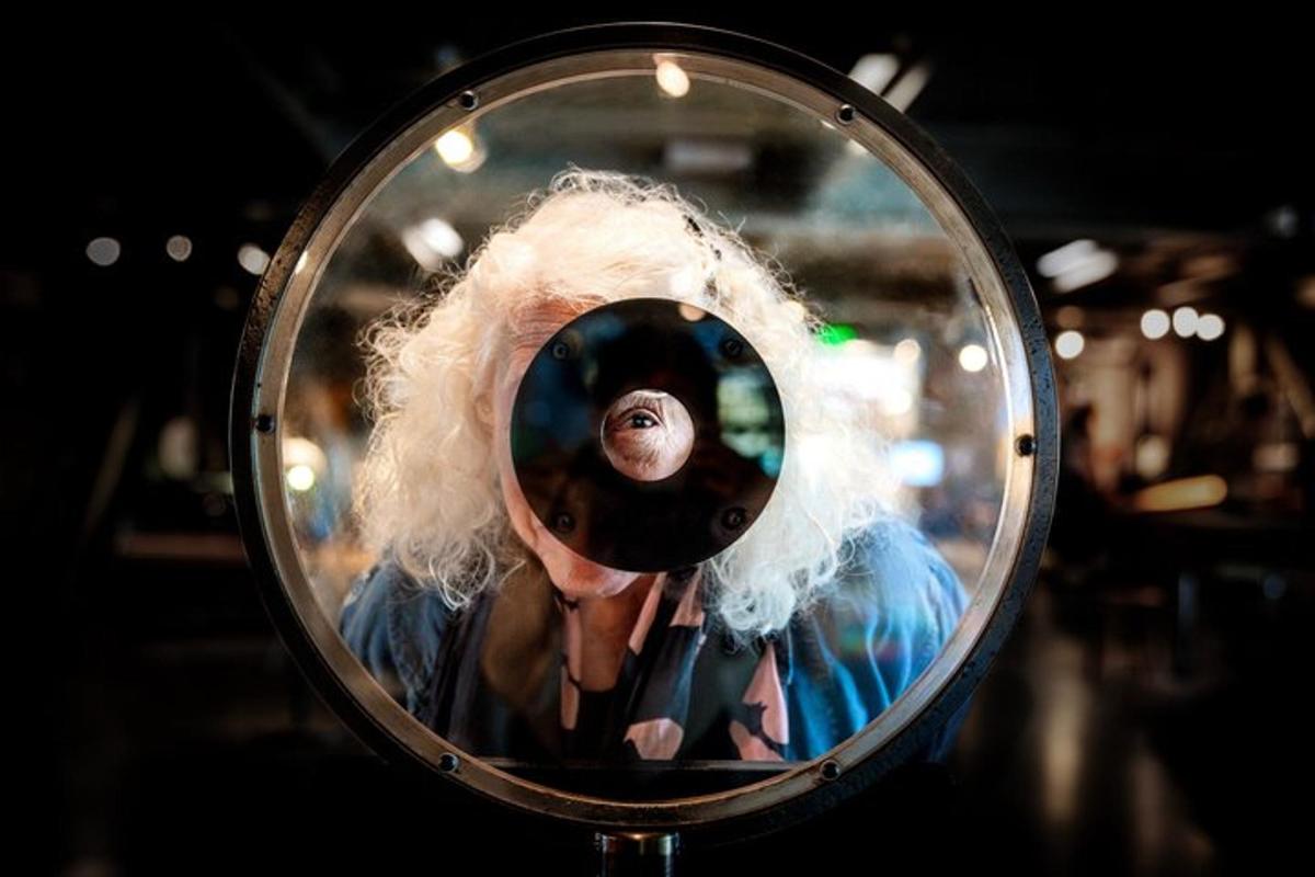 a person is taking a picture in a mirror