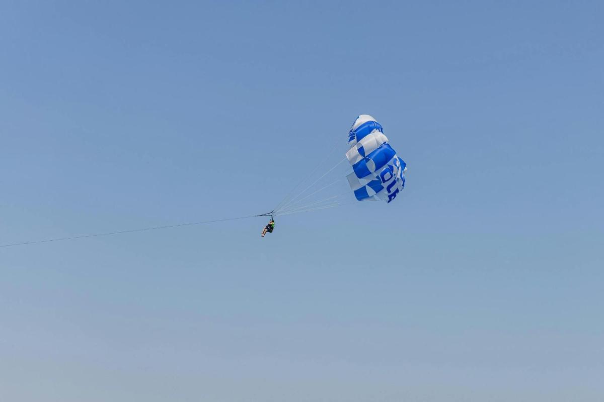 a kite flying in the blue sky
