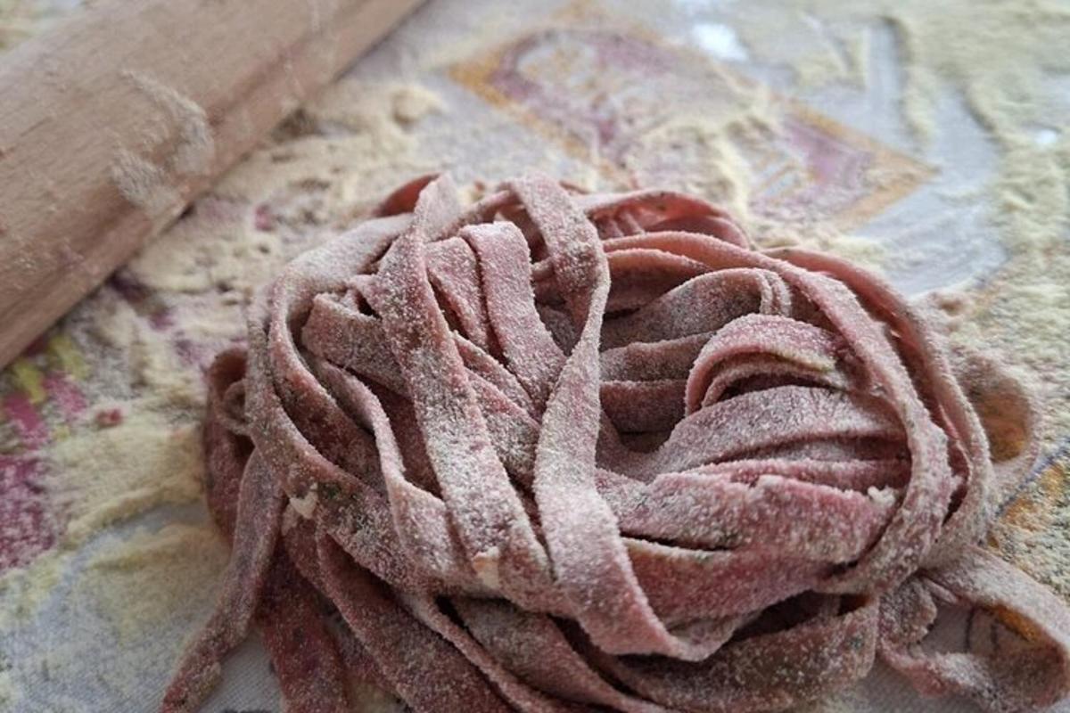 a coil of pink towel sitting on a table