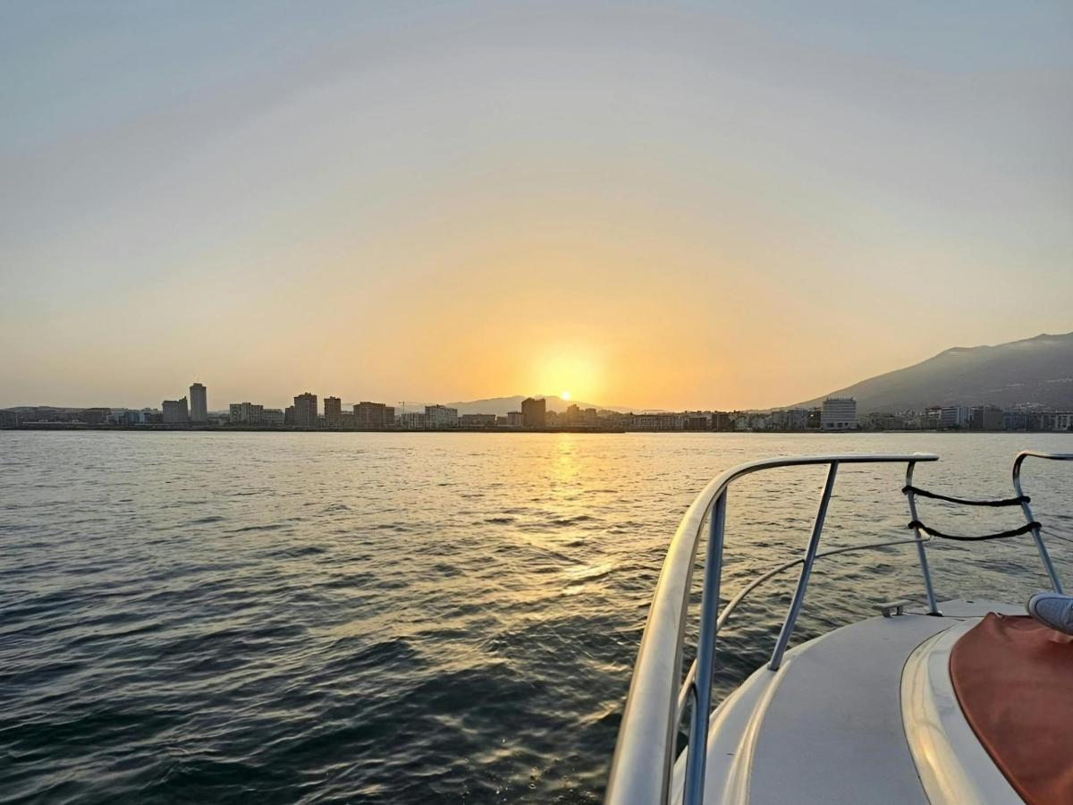 a boat on the water as the sun sets