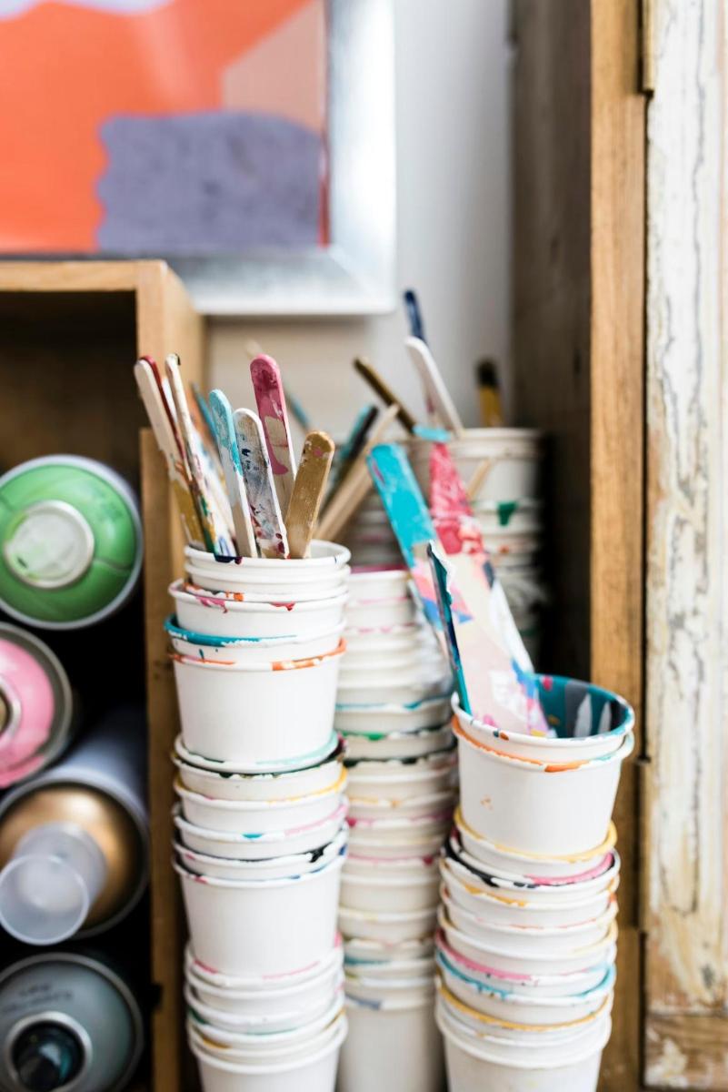 a stack of cups and plates in a cabinet