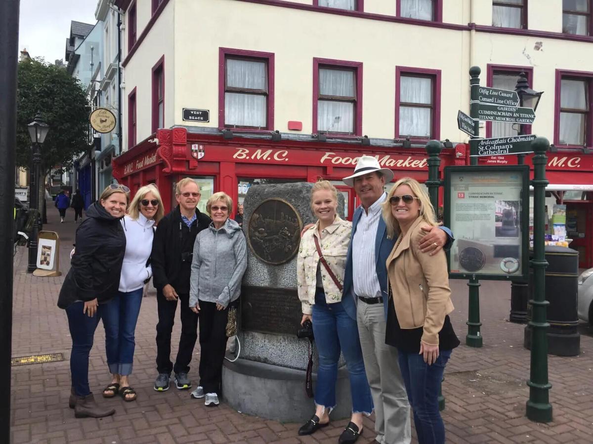 a group of people standing in front of a street