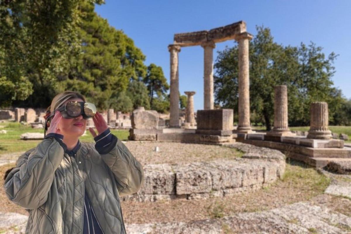 a woman taking a picture in front of a temple