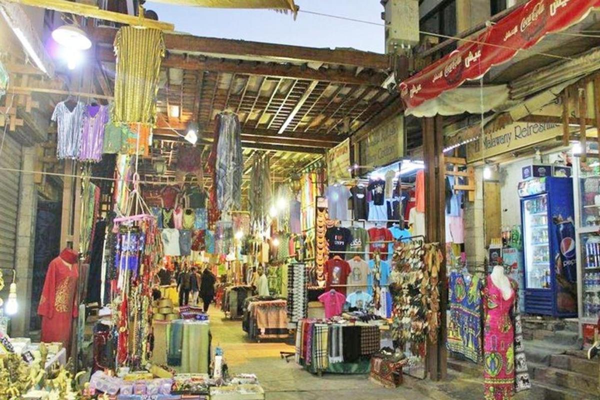 a store filled with lots of merchandise in a market