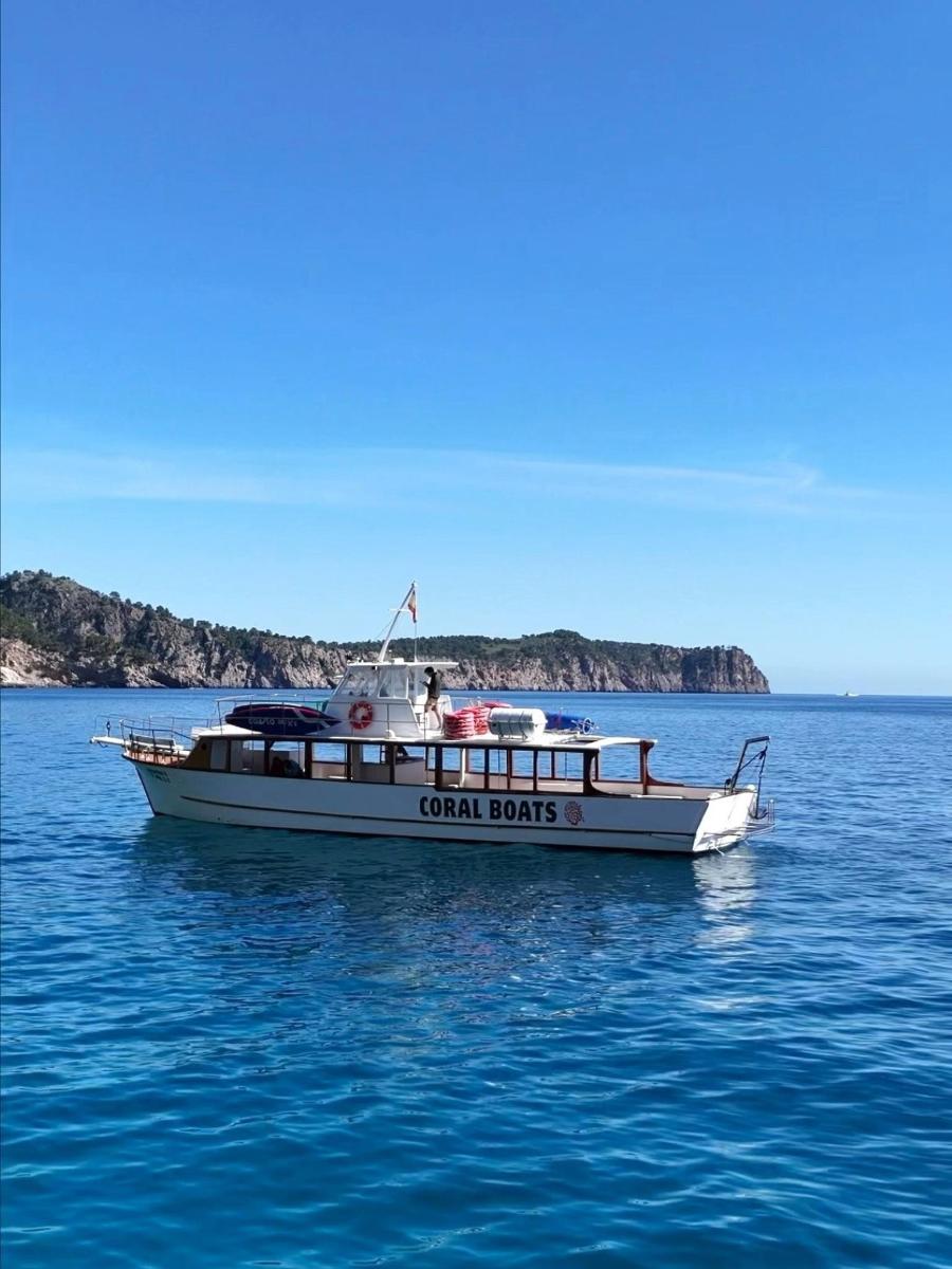 a boat in the water with two people on it