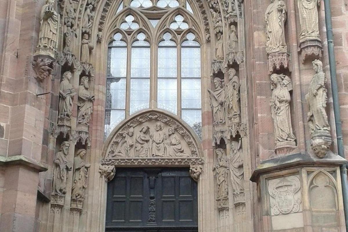 a building with a door with sculptures on it