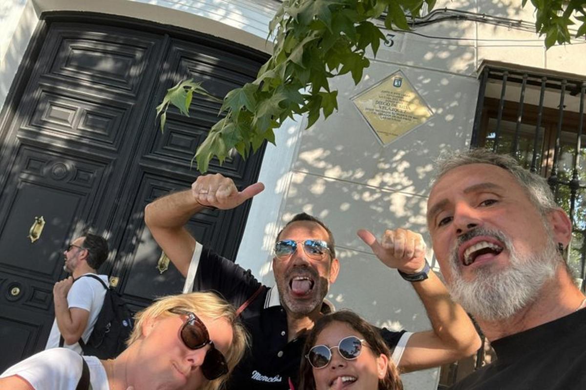 a group of people standing in front of a house