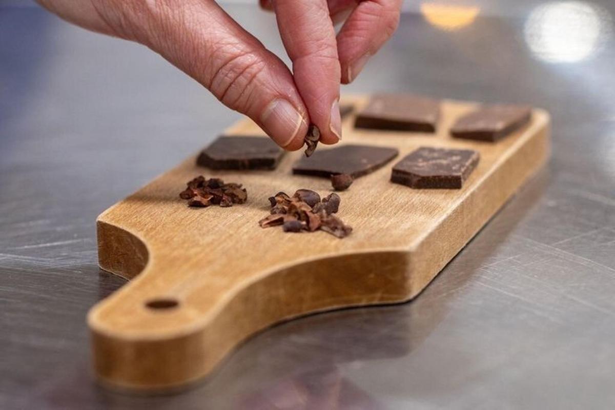 a person dropping coffee beans on a wooden board