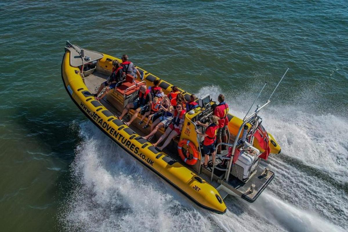 a group of people in a yellow raft in the water