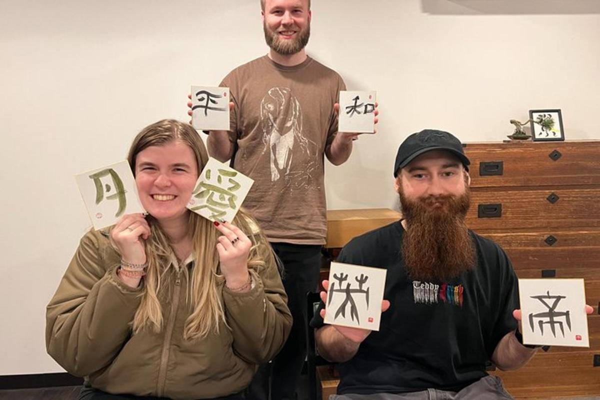 a group of three people holding up signs withigraphy