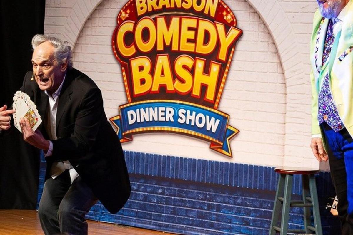 a man standing in front of a dinner show sign