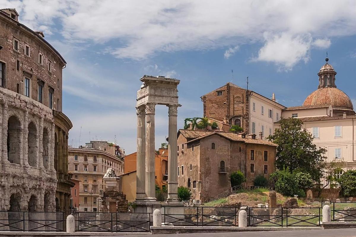 a view of a city with a column and buildings