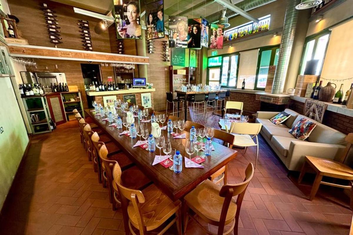 a long wooden table in a restaurant with chairs