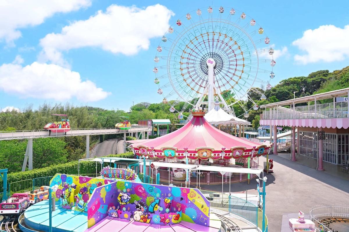 a carnival ride with a ferris wheel in the background