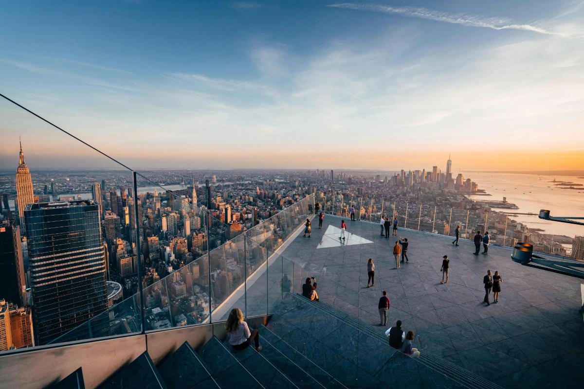 a view of the empire state building from the top of a skyscraper