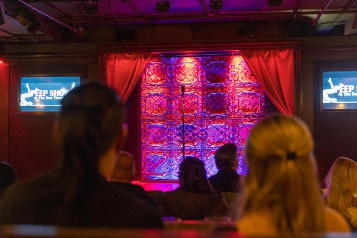 a group of people sitting in front of a stage